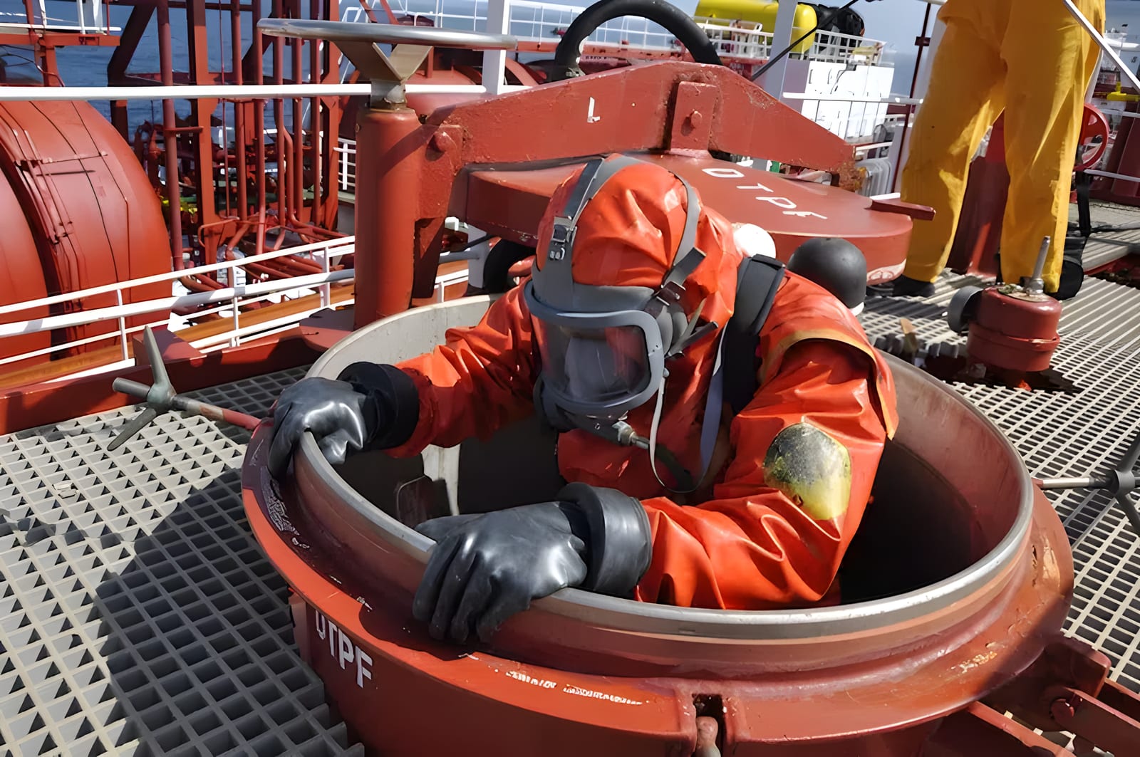 Marine engineer working in a confined space during an inspection